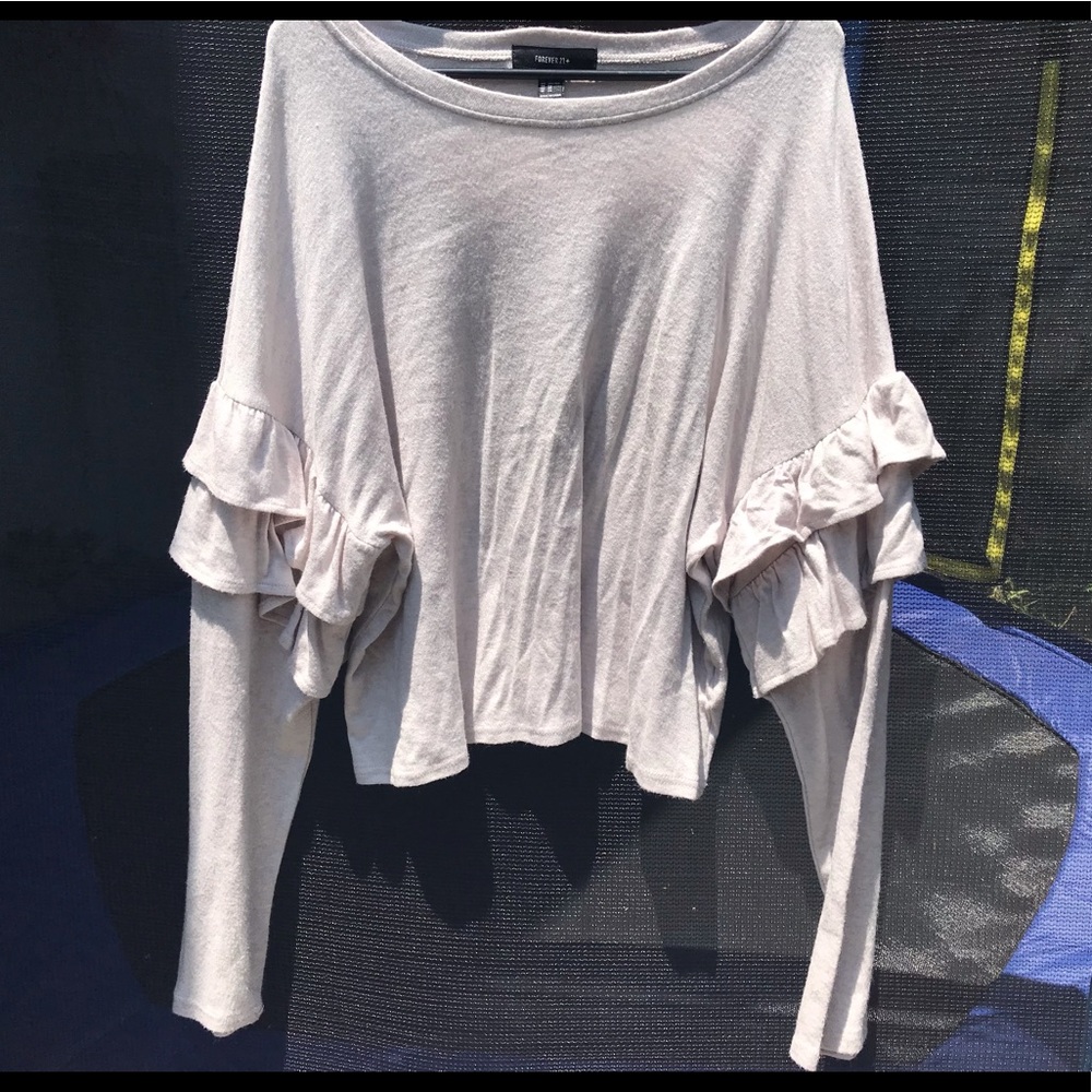 A brown ruffle long sleeve